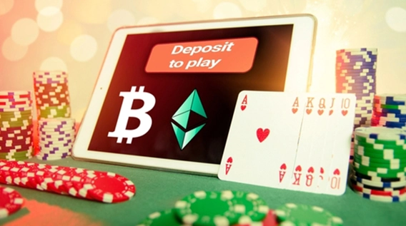 The depositing section at an online crypto casino, displayed by a tablet, playing cards and chips in front of it.