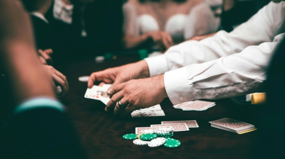 Dealer distributing cards in a casino blackjack game.