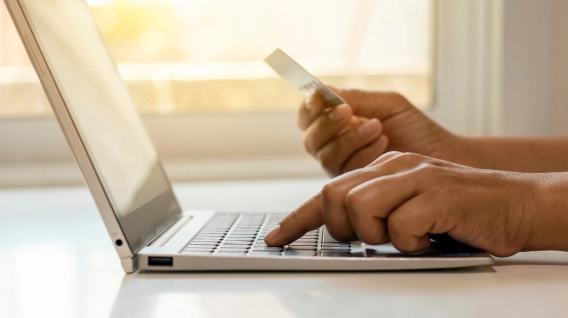 A person accessing the cashier section of an instant payout casino on a laptop.